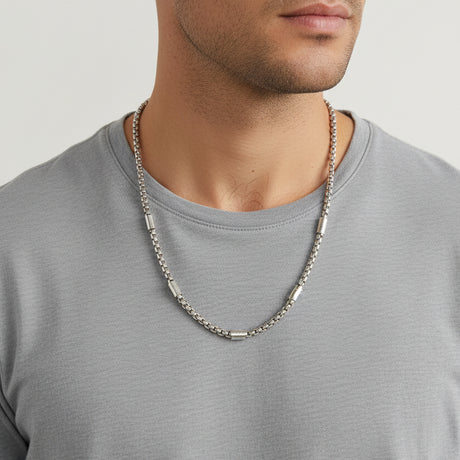 Silver box chain with slim bar links worn over a grey tee, Jack Gifts Online Lebanon