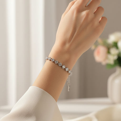 Silver bracelet with clear stones on a person's hand