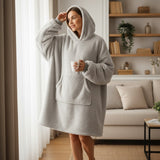 Full length view of a silver grey sherpa hooded blanket worn with the hood up