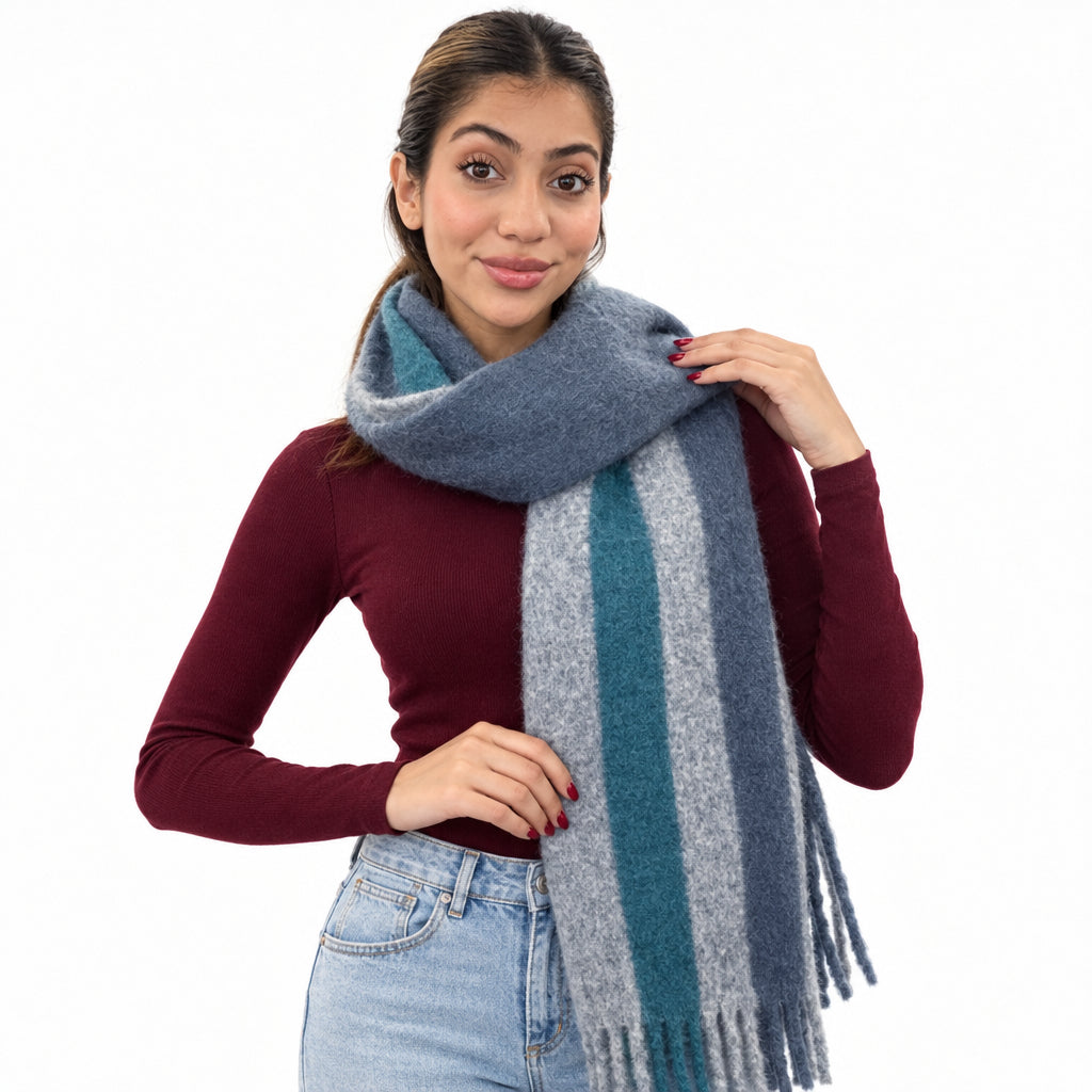 Woman in a burgundy top wearing a slate blue brushed scarf with a teal and grey stripe and fringe