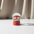 Snow globe with a waving Lebanese flag inside, on a red base printed with city names