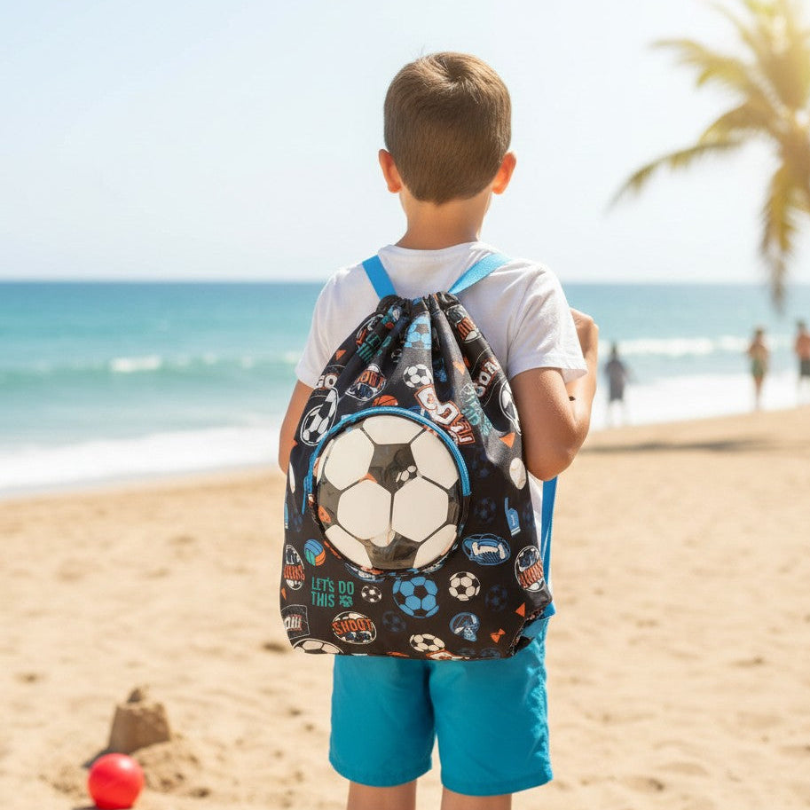 Boy wearing a black sports drawstring backpack with a clear round front pocket holding a football