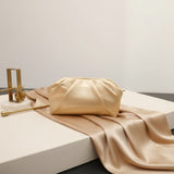 Champagne gold soft pleated pouch evening clutch