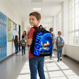 Child with a Sonic the Hedgehog backpack in a school hallway
