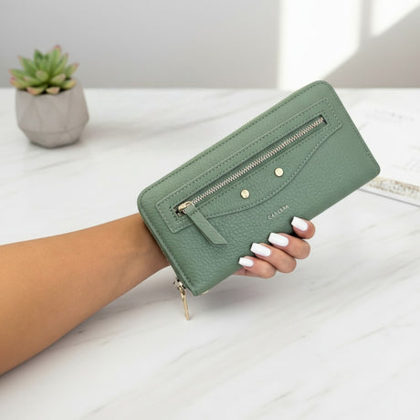 Green women's wallet with sleek zip design and gold accents