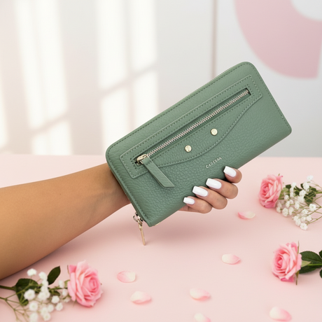 Green women's wallet with sleek zip design and gold accents