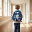Boy wearing a navy space mini backpack with astronaut and rocket print – Jack Gifts Online Lebanon
