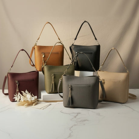 Six shoulder bags with front zip pockets and tassel charms in tan, black, burgundy, olive and beige