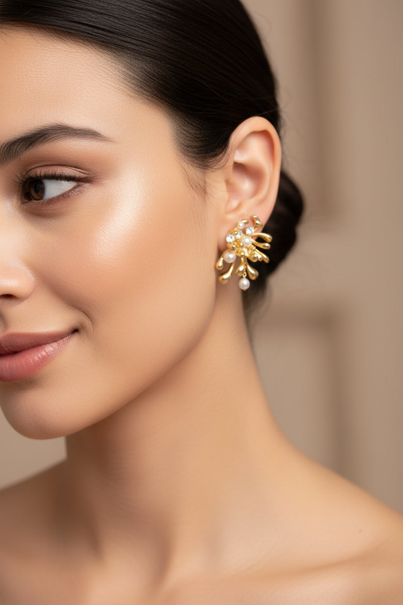 Woman wearing a gold earring with a blurred background