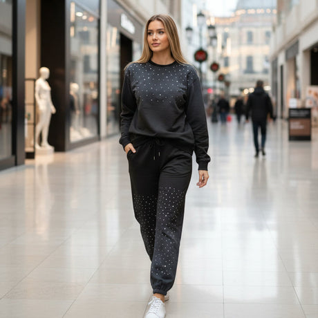 Woman in a sparkly sweatshirt and pants walking through a shopping mall