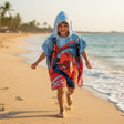 Boy running in a Spider-Man city hooded poncho towel – Jack Gifts Online Lebanon