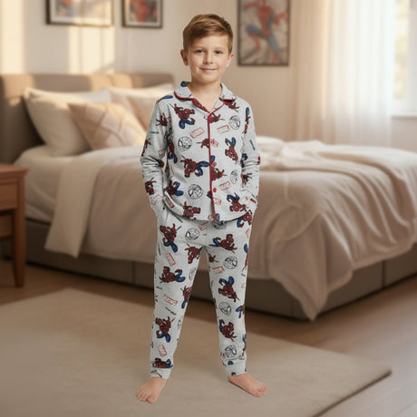 Child wearing Spider-Man pajamas in a bedroom setting
