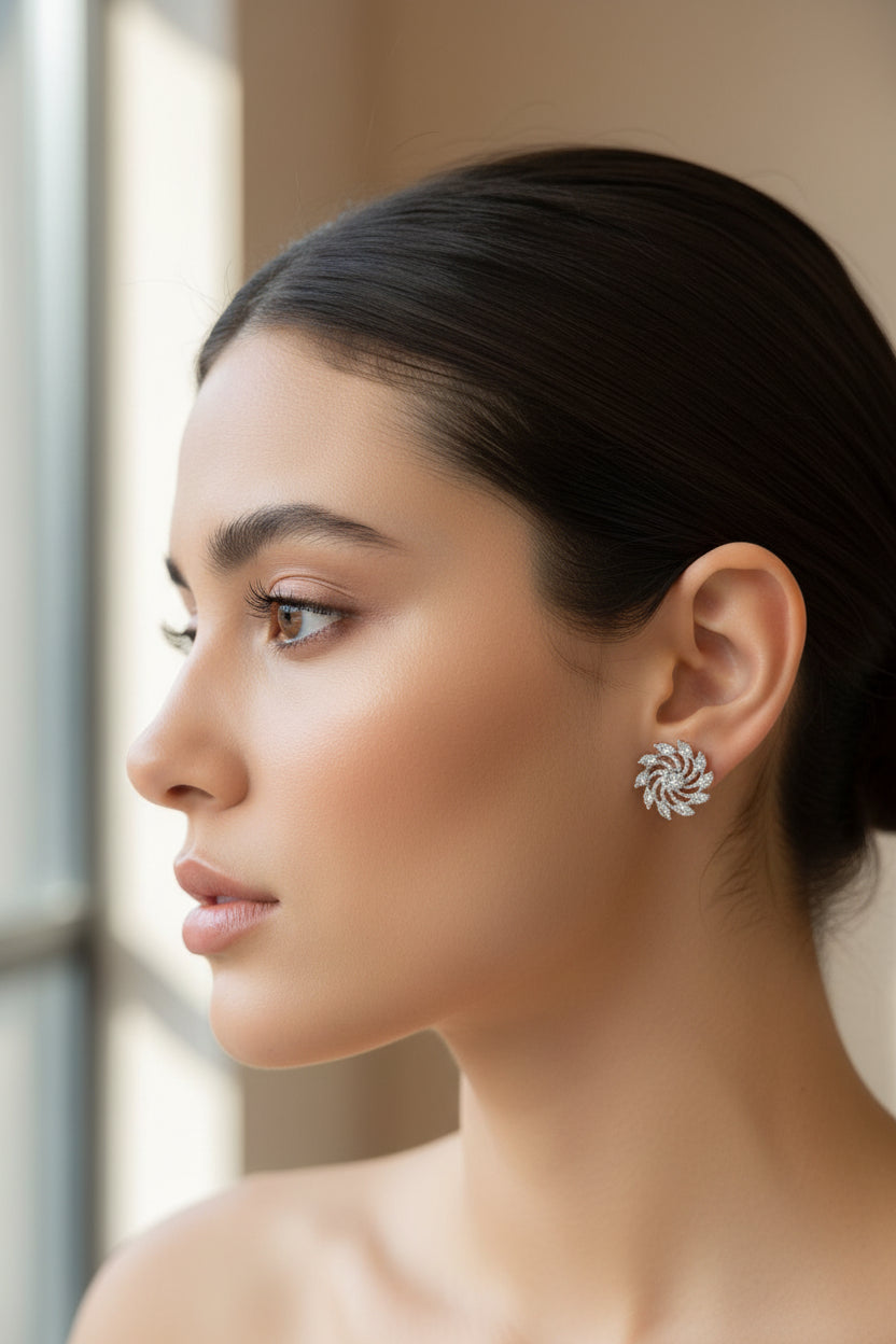 Woman wearing a silver circle earring with a blurred background