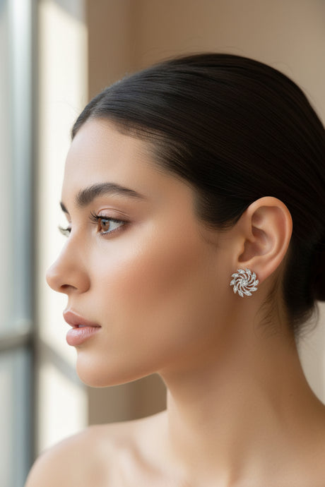 Woman wearing a silver circle earring with a blurred background