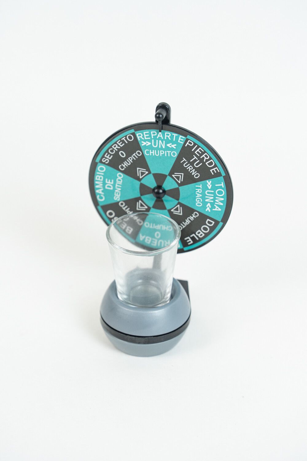 Full view of the eight segment wheel printed with Spanish dares and shot glass icons