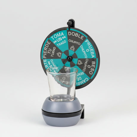 Spinning dare wheel in teal and charcoal on a post above a weighted base and shot glass