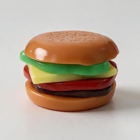 Stacked burger squishy with a sesame bun, lettuce, cheese, tomato and patty