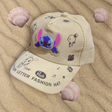 Beige cotton kids cap with a soft rubber cartoon patch and playful lettering on the brim