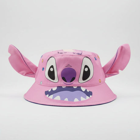 Pink character bucket hat with large ears, big eyes and a toothy smile on a plain backdrop
