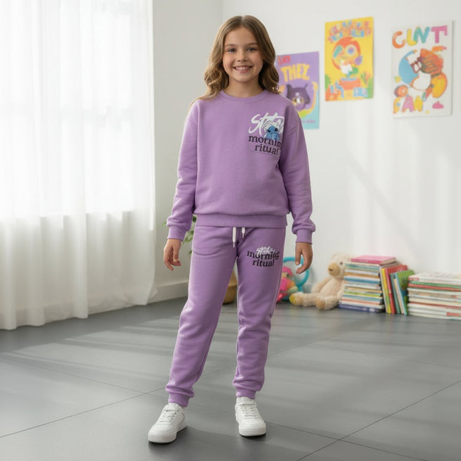 Full length view of a purple long sleeve sweatshirt and jogger set worn with white sneakers