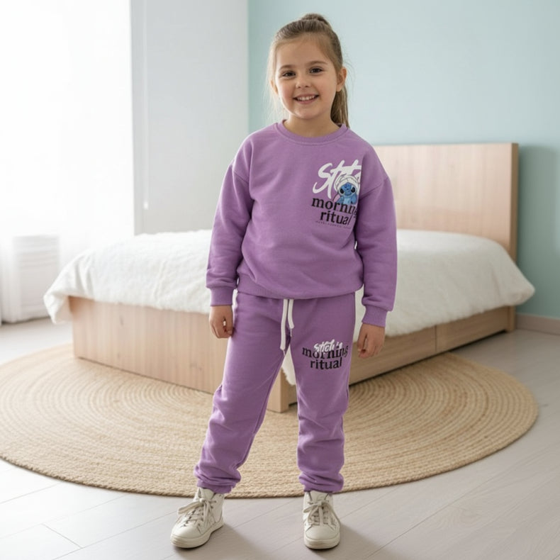 Girl in a lilac fleece sweatshirt and matching joggers with a small blue character chest graphic