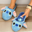 Cornflower terry mules with a flat stitched face and pink lined ears, one held in hand