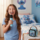 Girl singing into a light blue handheld microphone beside the matching character speaker