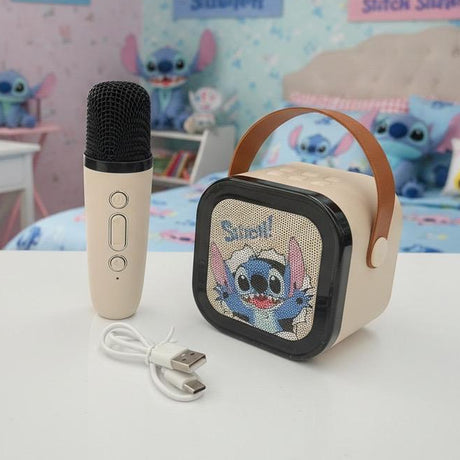 Cream speaker and microphone with the charging cable on a white desk