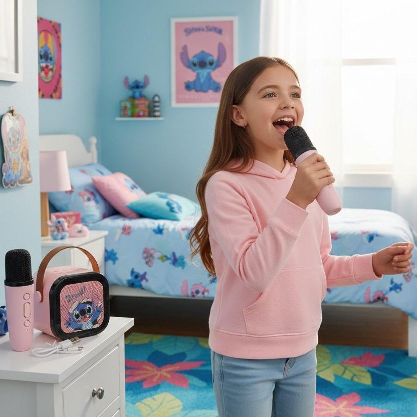 Pink speaker on a nightstand with two pink microphones showing their three control buttons