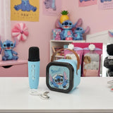 Blue toy speaker with a printed character grille, a matching handheld microphone and a USB cable