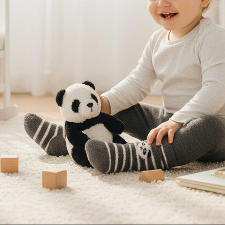 Striped panda socks with a soft panda face motif on the cuff