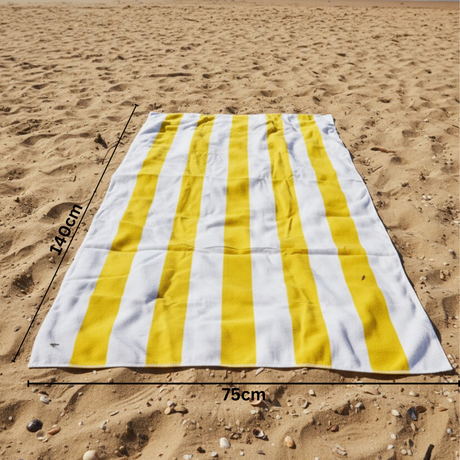 Yellow and white striped beach towel on sand with 75x140 cm size