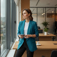 Women's teal open front blazer with notched lapels and rolled long sleeves