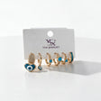 Six single huggie earrings in gold and teal with a heart evil eye drop and turquoise stones