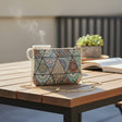 Teal mandala tapestry crossbody bag with a zip top and gold chain