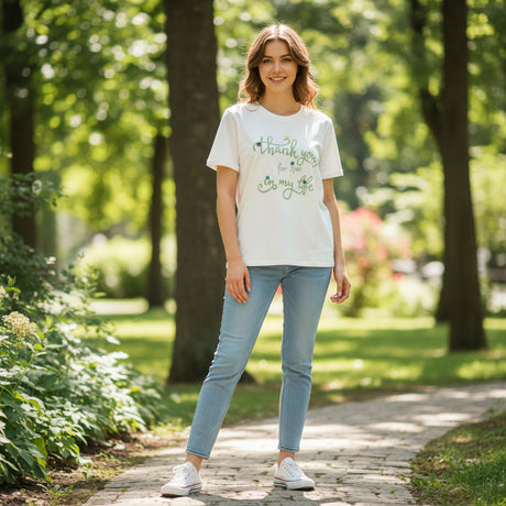 Green lettering version worn on a leafy garden path
