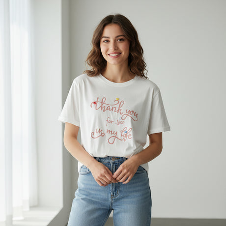 Thank you script printed in pink across a white tee