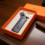 Cigar lighter with 'lubinski' branding in an orange box on a wooden surface