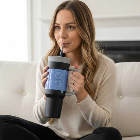 Matte black insulated tumbler with a grey lid, loop handle and black straw