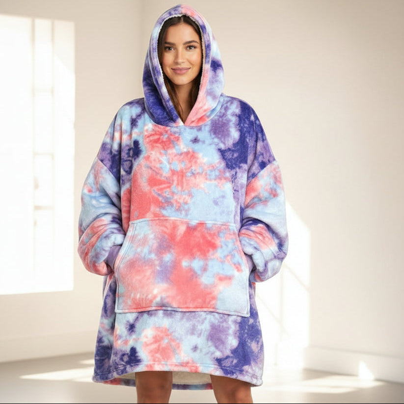 Sunlit empty room, hands in the pocket, coral and indigo marbling across a raised hood