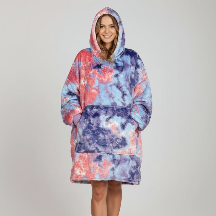 Studio backdrop, hood raised, in a marbled coral, sky blue and indigo wearable blanket
