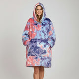 Studio backdrop, hood raised, in a marbled coral, sky blue and indigo wearable blanket