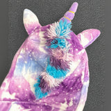 Top of the unicorn robe hood showing horn, ears and fluffy rainbow mane