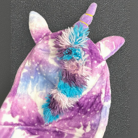 Top of the unicorn robe hood showing horn, ears and fluffy rainbow mane
