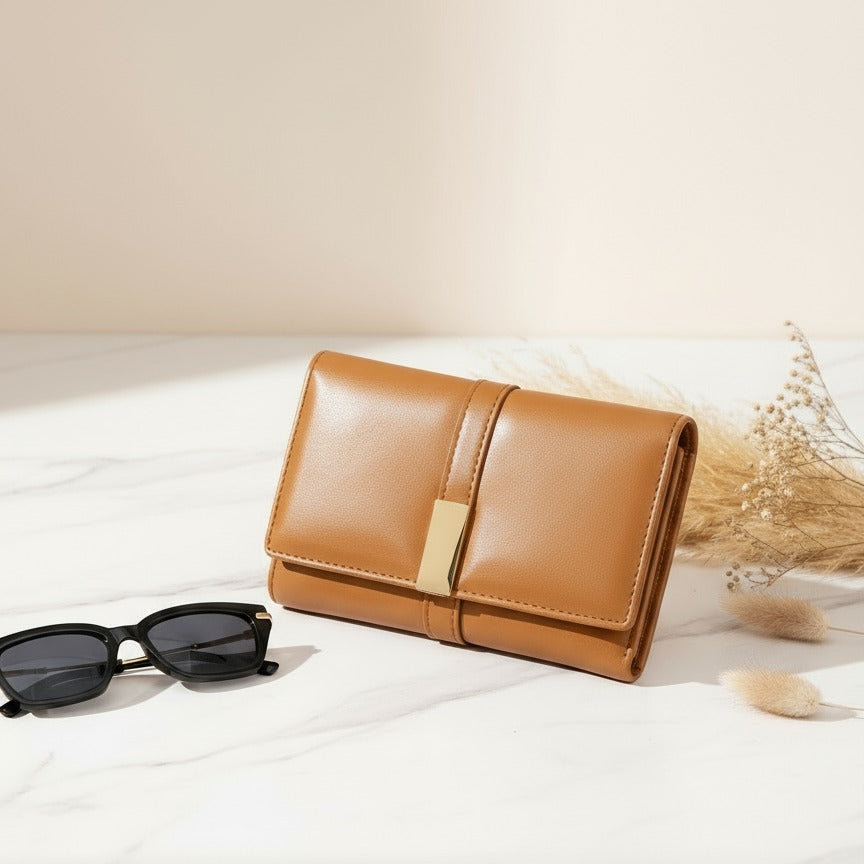 Havan leather wallet with sunglasses on a light surface