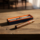 Cigar and titan torch lighter in a box on a wooden table
