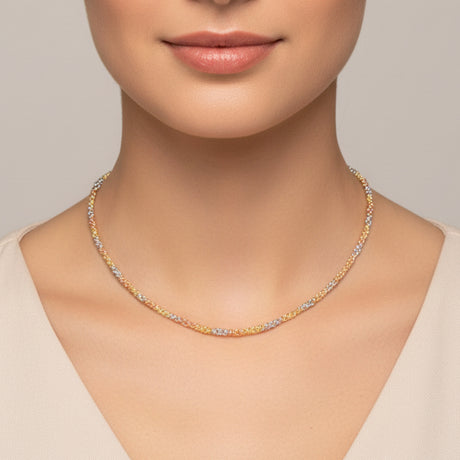 Tri-tone beac necklace with gold and silver beads worn by a person on a white background