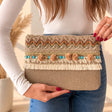 Beige clutch bag with chevron braid, turquoise beads, beige pom poms and cream fringe