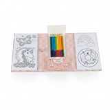 An open children's coloring book set on a white background, featuring white coloring pages with black line art of a unicorn, rainbow, and donut