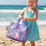 Girl in a blue polka dot dress carrying a unicorn print clear tote, marked 25cm tall and 20cm wide